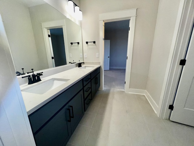 bathroom with vanity and tile patterned flooring