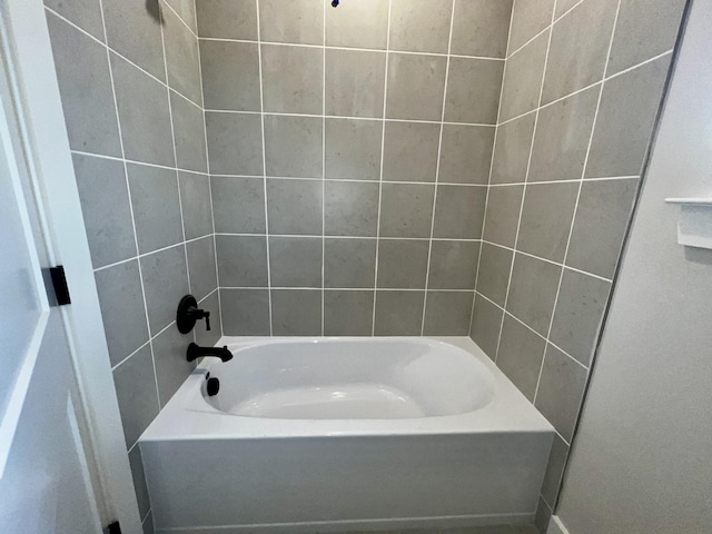 bathroom with shower / washtub combination