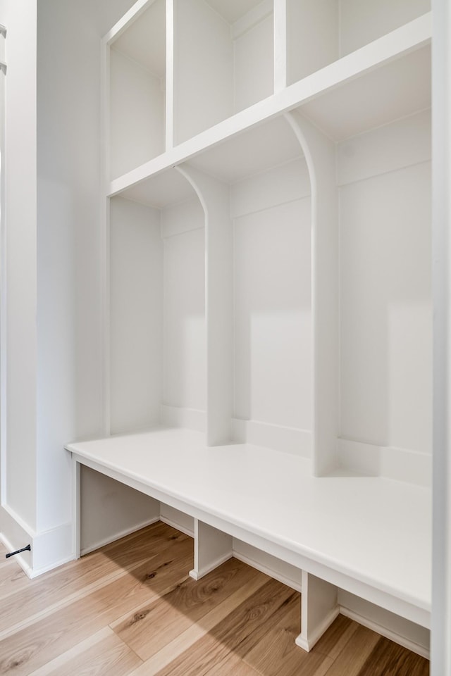 mudroom with hardwood / wood-style flooring