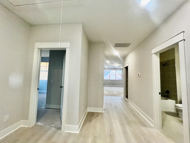 hallway featuring light hardwood / wood-style floors