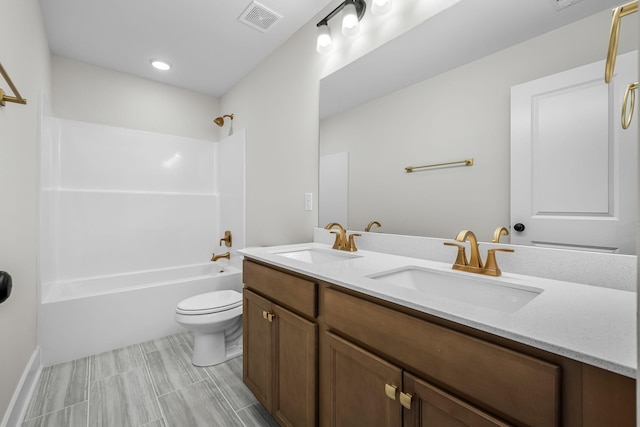 full bathroom featuring vanity, toilet, and tub / shower combination