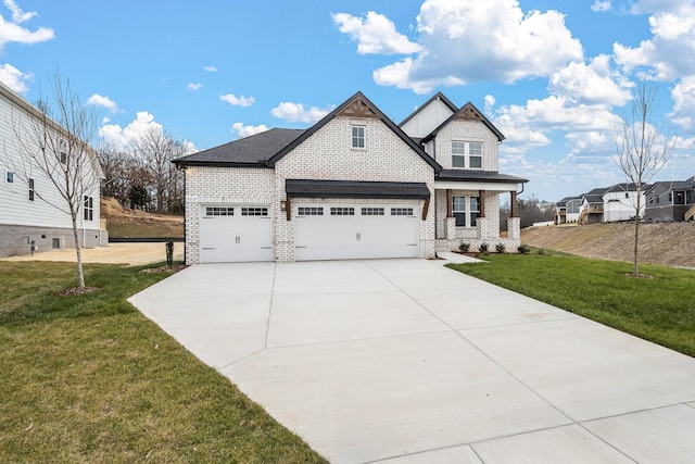 view of front of house featuring covered porch and a front yard