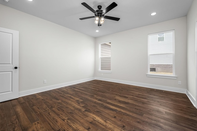 unfurnished room featuring ceiling fan and dark hardwood / wood-style floors