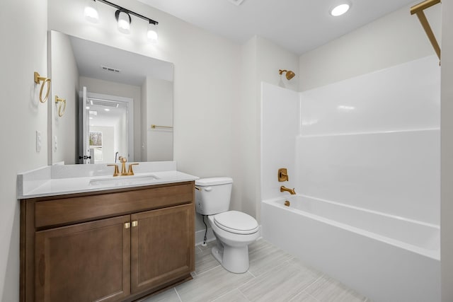 full bathroom featuring vanity, toilet, and tub / shower combination