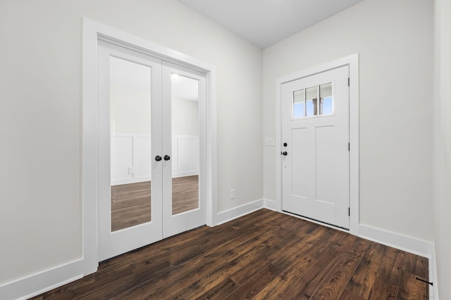 entrance foyer with dark hardwood / wood-style floors and french doors