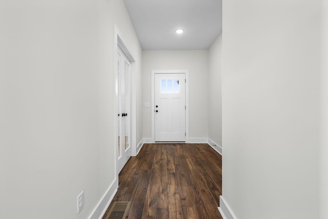 doorway to outside featuring dark hardwood / wood-style flooring