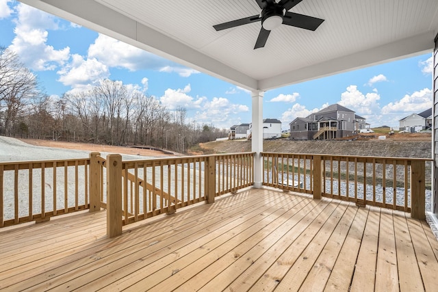 wooden terrace featuring ceiling fan