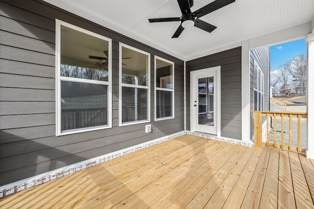 wooden deck with ceiling fan