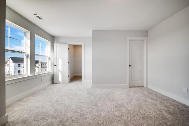 empty room featuring light carpet