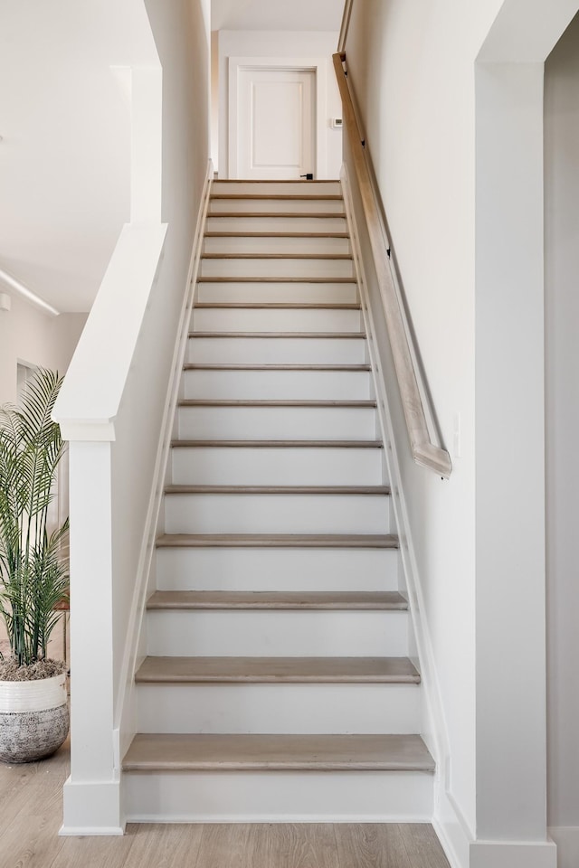 staircase featuring hardwood / wood-style floors