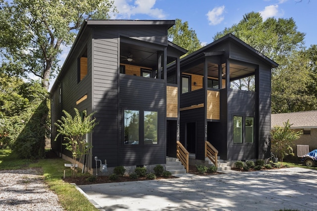 contemporary house featuring ceiling fan