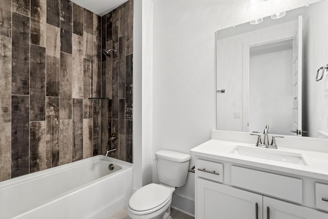 full bathroom with toilet, tiled shower / bath, and vanity