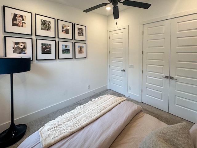 carpeted bedroom featuring a closet and ceiling fan