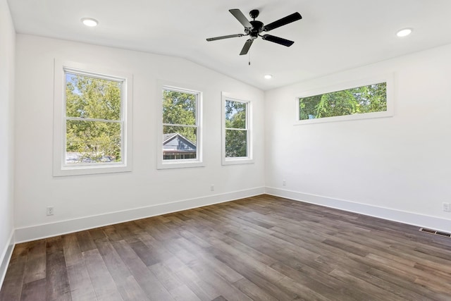 unfurnished room featuring ceiling fan, dark hardwood / wood-style flooring, and lofted ceiling