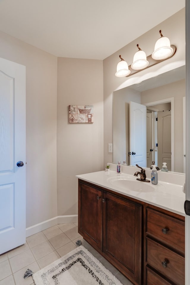 bathroom with tile patterned floors and vanity