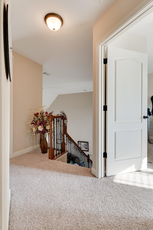 hall featuring carpet