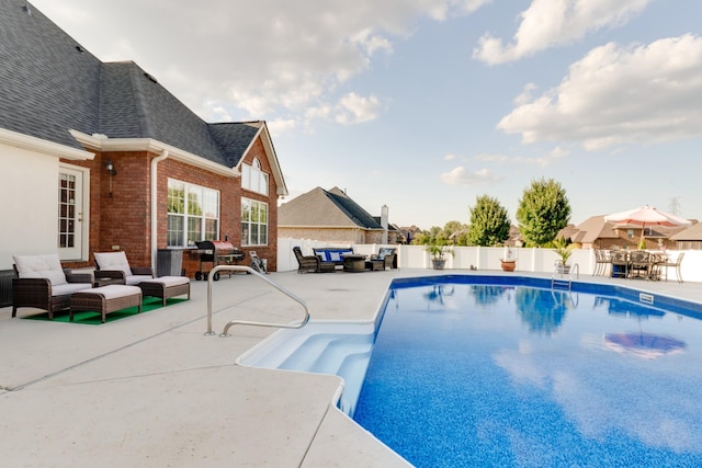 view of swimming pool with an outdoor hangout area and a patio