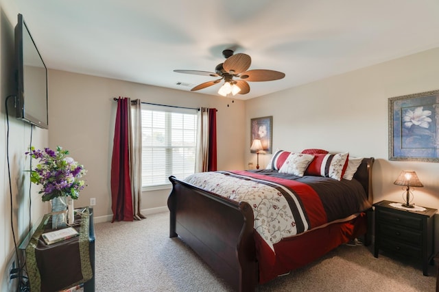 bedroom featuring ceiling fan and light carpet