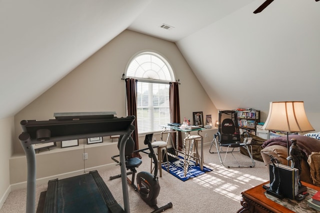 workout area with light colored carpet, vaulted ceiling, and ceiling fan