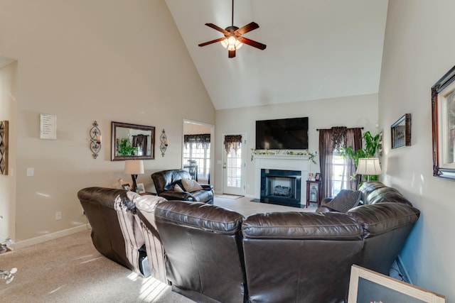 carpeted living room featuring high vaulted ceiling and ceiling fan