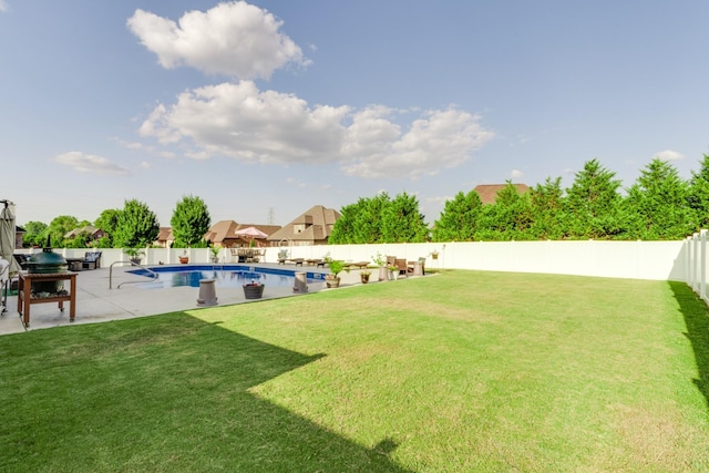 view of yard with a fenced in pool and a patio