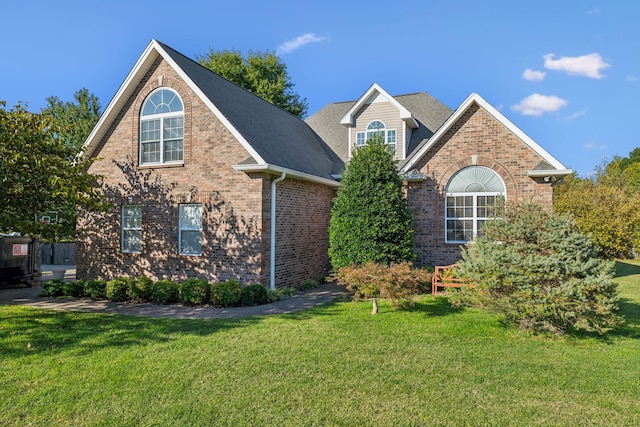 front facade with a front yard