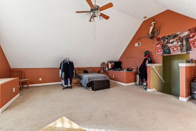 bedroom featuring carpet flooring, vaulted ceiling, and ceiling fan