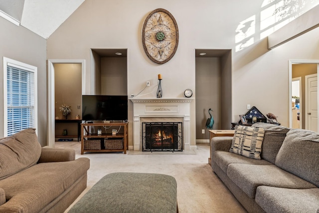 living room with light carpet and high vaulted ceiling