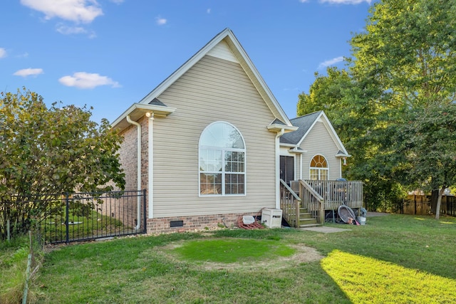 view of front of property with a wooden deck and a front yard