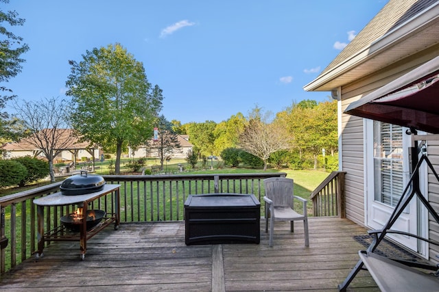 wooden deck with a lawn