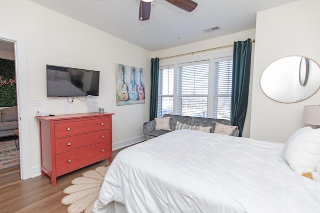 bedroom featuring hardwood / wood-style floors and ceiling fan