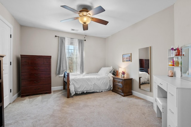 bedroom featuring ceiling fan and light colored carpet