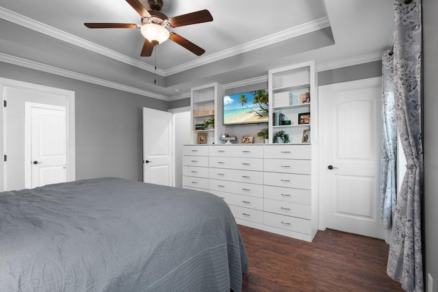 bedroom with ceiling fan, a raised ceiling, ornamental molding, and dark wood-type flooring