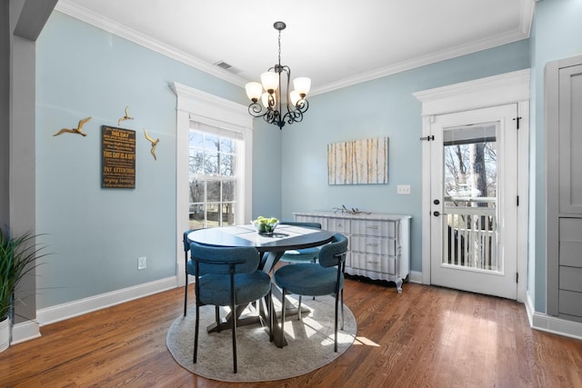 dining room with crown molding, plenty of natural light, and dark hardwood / wood-style flooring