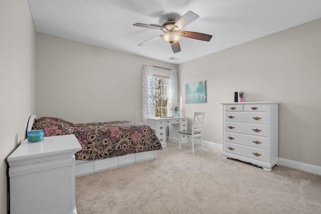 bedroom featuring ceiling fan and light carpet