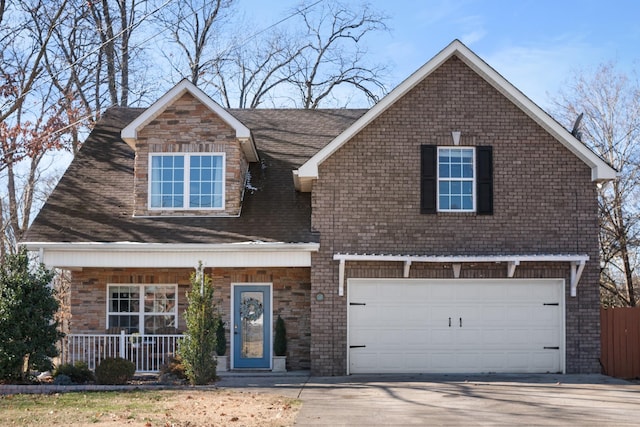 view of front facade featuring a garage and covered porch