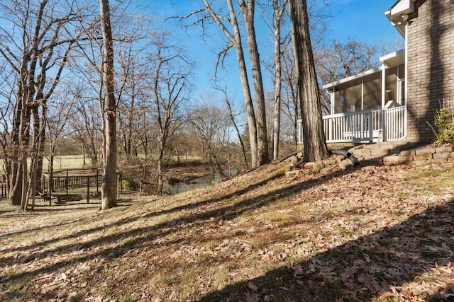 view of yard featuring a sunroom