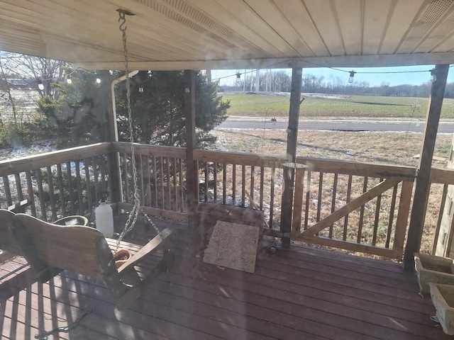 wooden terrace with a rural view