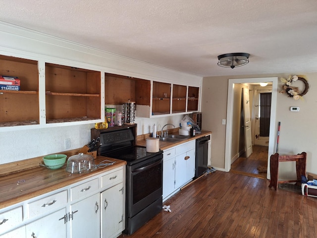 kitchen featuring white cabinets, dishwasher, sink, dark hardwood / wood-style floors, and electric range