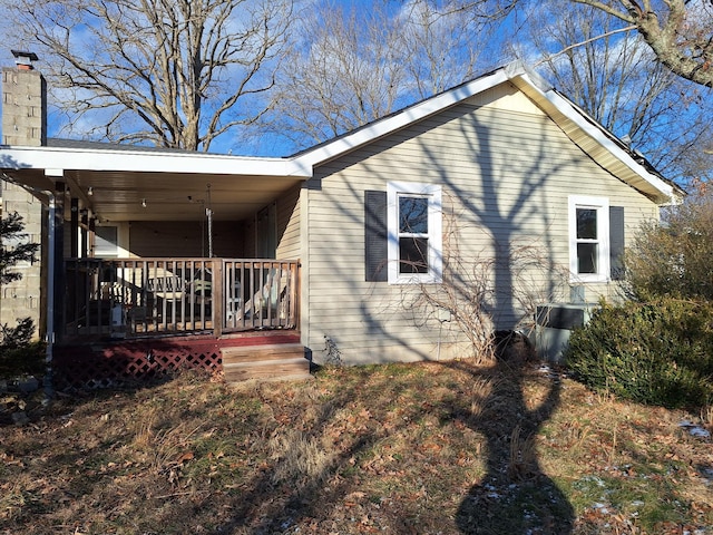 view of side of property with a porch