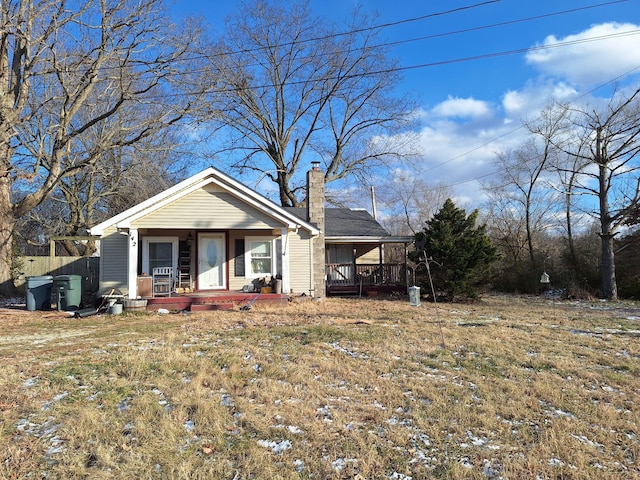 view of front facade with a front lawn and a porch