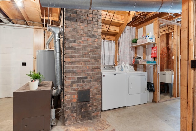 laundry area featuring separate washer and dryer and water heater