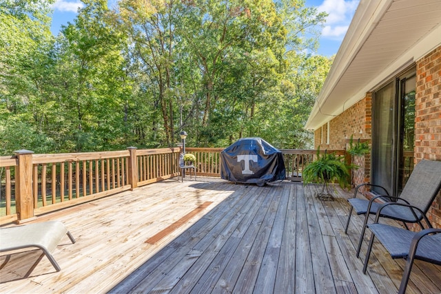 wooden deck featuring grilling area