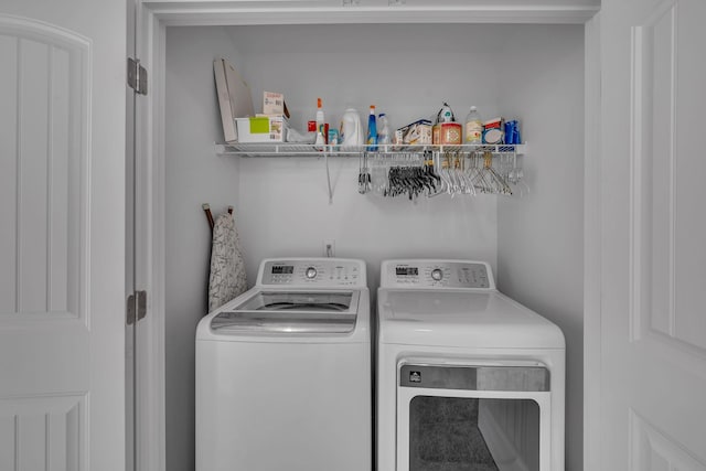 clothes washing area featuring washing machine and dryer