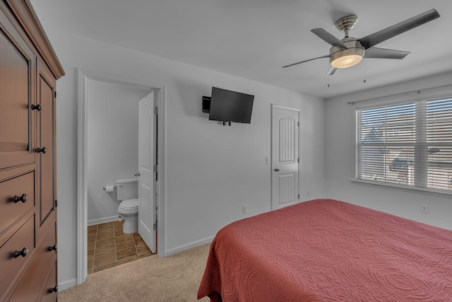 carpeted bedroom featuring ceiling fan and connected bathroom