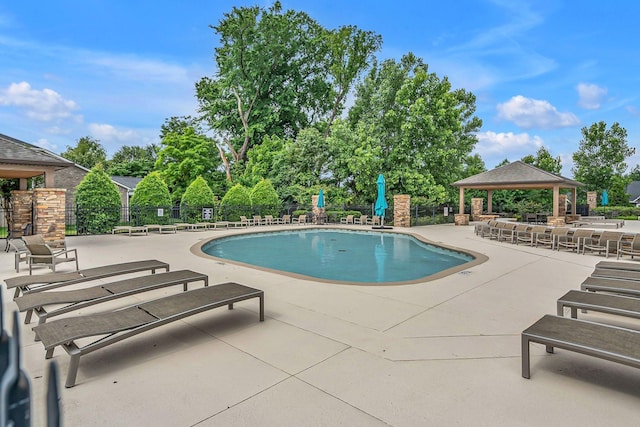 view of swimming pool with a patio area and a gazebo