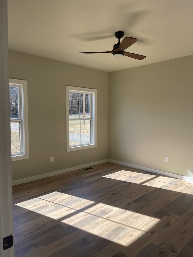 spare room with ceiling fan and hardwood / wood-style floors