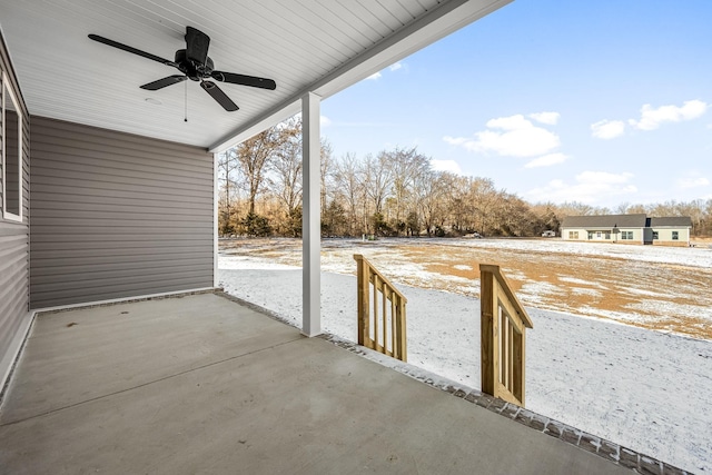 snow covered patio with ceiling fan