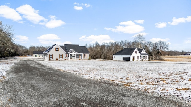 cape cod home with a garage