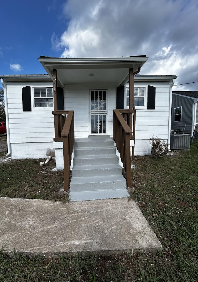 view of front of home featuring cooling unit